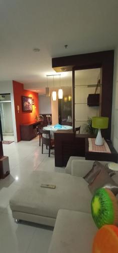 a living room with a couch and a table at Apartemen Thamrin City 2 BIG BR,85sqm,City View in Jakarta