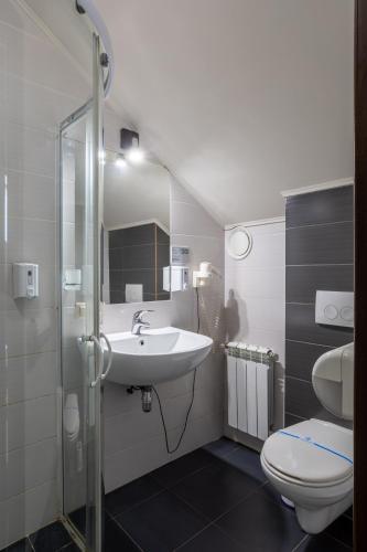 a bathroom with a sink and a toilet at DREAM Hostel Kyiv in Kyiv
