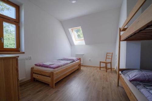 Katil atau katil-katil dalam bilik di Šedivinské apartmány - rodinné apartmány v Orlických horách