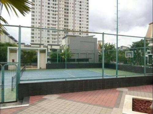 a tennis court with a tennis racket on it at Apartemen Thamrin City 2 BIG BR,85sqm,City View in Jakarta