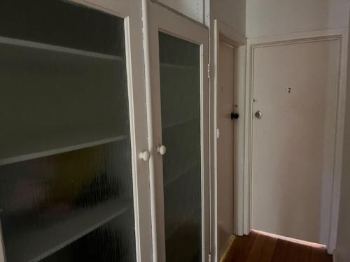 an empty room with a glass door and a closet at Gorgeous Master Bedroom with Own Bath in Frankston