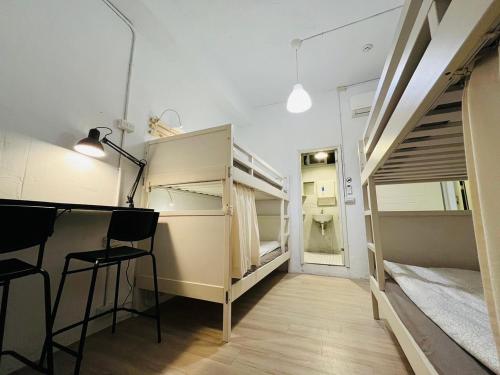 Postel nebo postele na pokoji v ubytování Ruifang Yi Hostel