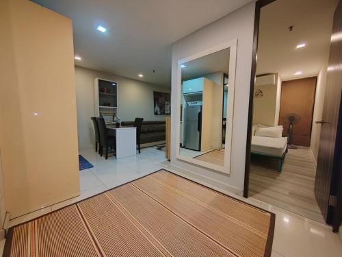 a living room with a kitchen and a dining room at Ber-Santai @Sky Hotel Suites in Kota Kinabalu