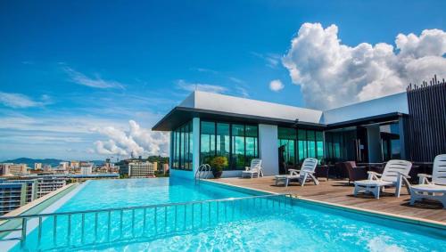 a swimming pool on the roof of a building at Ber-Santai @Sky Hotel Suites in Kota Kinabalu