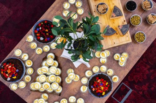 a table with a bunch of snacks and a plant at Milling Hotel Park in Middelfart