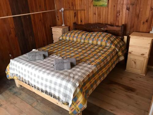a bedroom with a bed with two towels on it at Isla Curubica in Tigre
