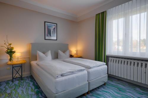 Letto o letti in una camera di Meeressterne Hotel Residenz in Heringsdorf