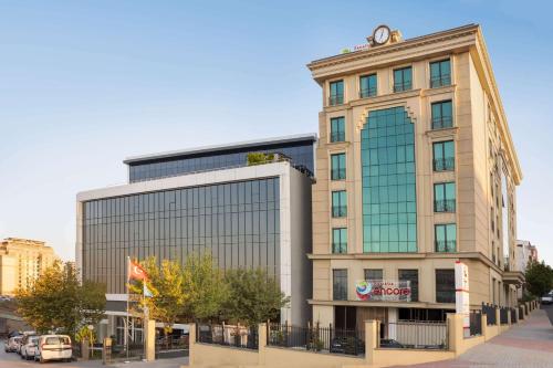 a building with a sign on the front of it at Ramada Encore By Wyndham Istanbul Basin Express in Istanbul