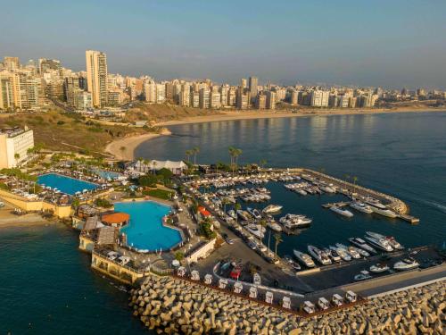an aerial view of a marina with boats in the water at Mövenpick Hotel Beirut in Beirut
