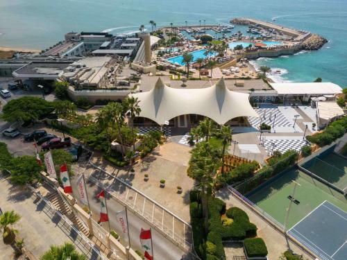 an aerial view of a resort with a pool at Mövenpick Hotel Beirut in Beirut