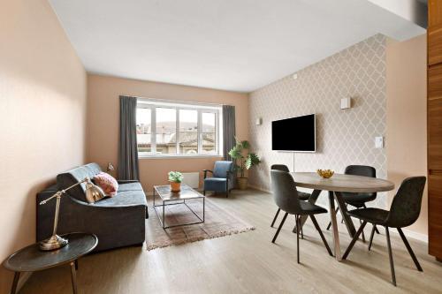 a living room with a couch and a table at Ole Bull, Best Western Signature Collection in Bergen