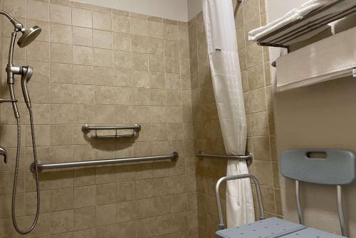 a shower stall in a bathroom with a toilet at Wingate by Wyndham Marion in Marion