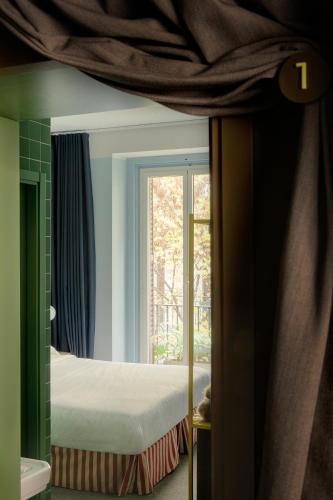 Ένα ή περισσότερα κρεβάτια σε δωμάτιο στο Armesto Rooms