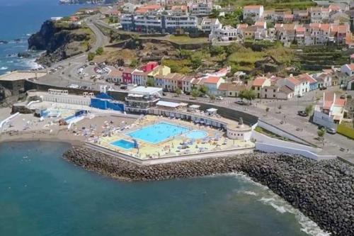 an aerial view of a resort next to the ocean at Casa Miradouro in Ribeira Grande