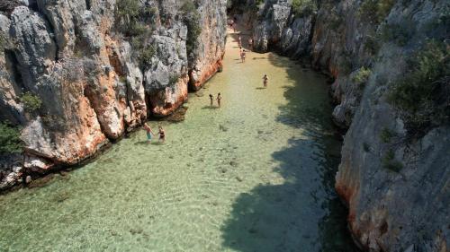 a group of people in the water in a canyon at Blue Cruise in Kas
