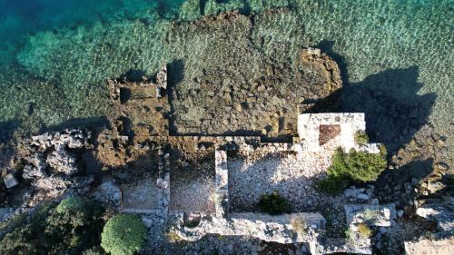 an aerial view of a castle on the ocean at Blue Cruise in Kas