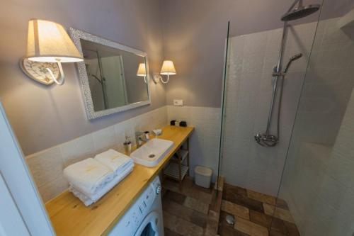 a bathroom with a sink and a shower at Kyiv Prince Apartment in Kyiv