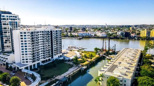 an aerial view of a large building next to a river at Dockside Brisbane in Brisbane