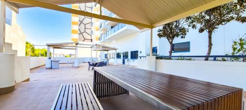 a bench on the outside of a building at Dockside Brisbane in Brisbane