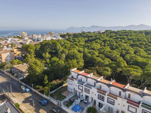 an aerial view of a city with a building at Can Bennasar in Can Picafort