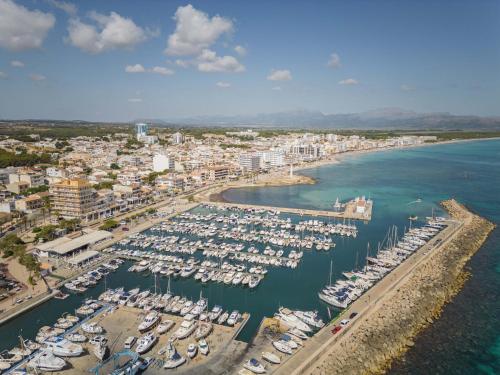 an aerial view of a harbor with boats in the water at Can Bennasar in Can Picafort