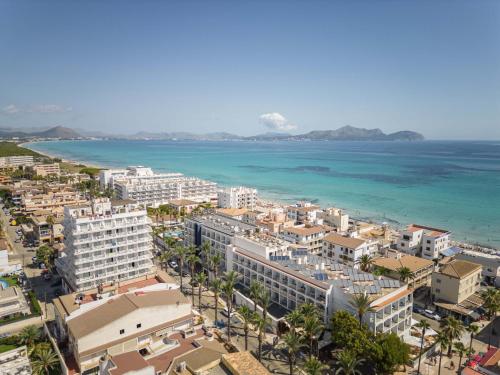 an aerial view of a city and the ocean at Can Bennasar in Can Picafort
