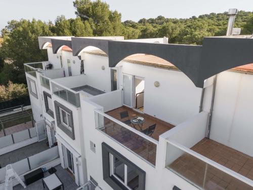 an aerial view of a white building with a balcony at Can Bennasar in Can Picafort