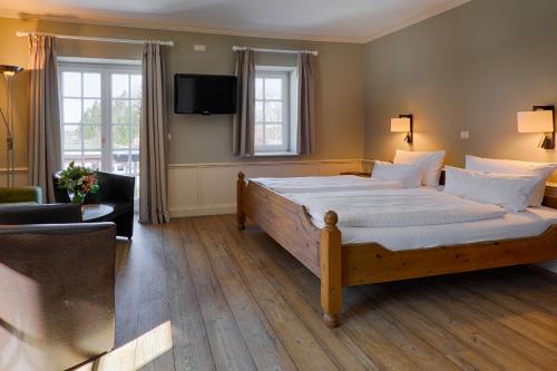 Katil atau katil-katil dalam bilik di Meeressterne Hotel Forsthaus Damerow