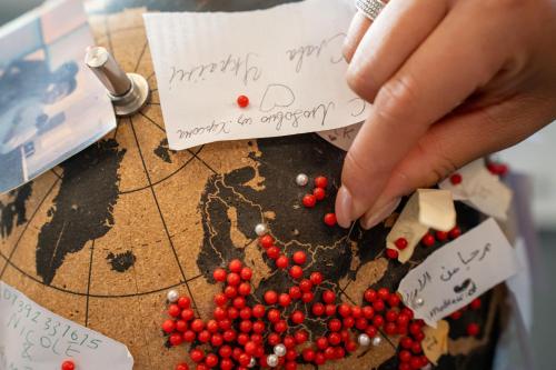 a person playing a game on a table with cranberries at Babila Hostel & Bistrot in Milan