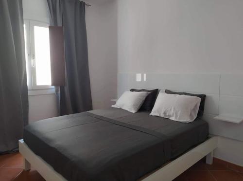 Ένα ή περισσότερα κρεβάτια σε δωμάτιο στο Apartament in Porto Antigo 2 - Santa Maria