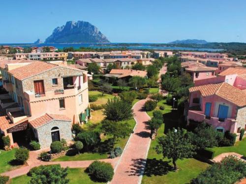 an aerial view of a village with houses at ESMERALDA'S ROOMS in Porto San Paolo