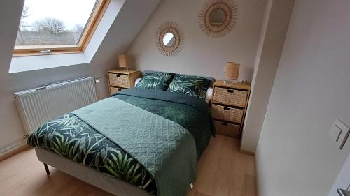 a bedroom with a bed and two dressers and a mirror at Hermelgemhoeve - Liriope in Zwalm