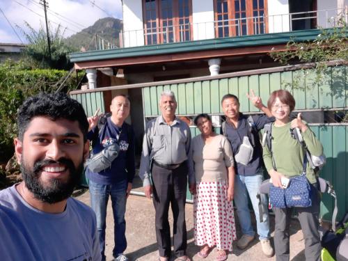 a group of people standing in front of a building at Green Villa in Nuwara Eliya