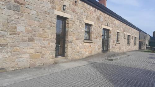 a brick building with windows on the side of it at Rathgillen House in Nobber