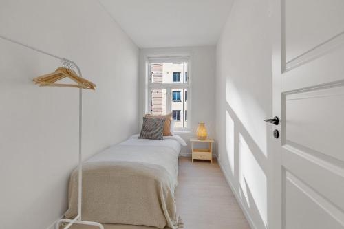 a bedroom with two beds and a window at Fantastic apartment in Oslo in Oslo