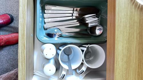 a drawer filled with utensils and spoons at Heatherbrae Guest House in Kyle of Lochalsh