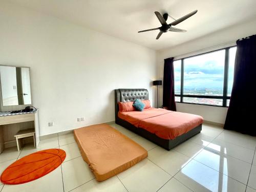 a bedroom with a bed and a ceiling fan at Entire Condominium @ Woodsburry Butterworth Penang in Butterworth