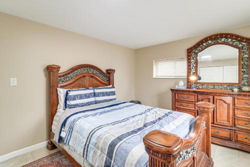 a bedroom with a bed and a dresser and a mirror at Farmington Hills Vacation Rental, 20 Mi to Detroit in Farmington Hills