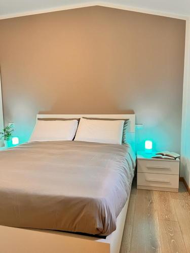a bedroom with a large bed with two white pillows at Alloggio Aquila d'Oro in Creazzo