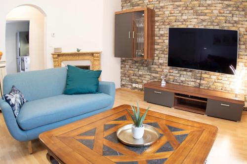 TV a/nebo společenská místnost v ubytování Kasa Jura 2 - Centre ville - Proche pistes de ski