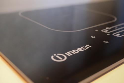 a close up of the d charger logo on a cell phone at Emerald Green Residence in Caldiero