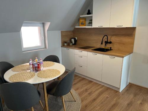 a kitchen with a table and chairs in a kitchen at Mimsy house in Plovdiv