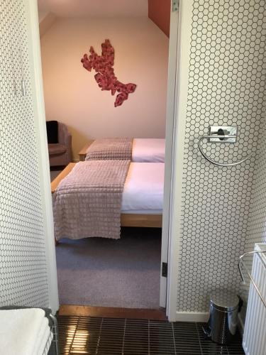 Postel nebo postele na pokoji v ubytování Heatherbrae Guest House