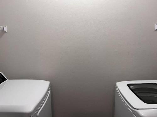 a bathroom with a toilet and a sink at ALL034 - Luxe 2BD 2BA Apt in Allen in Allen