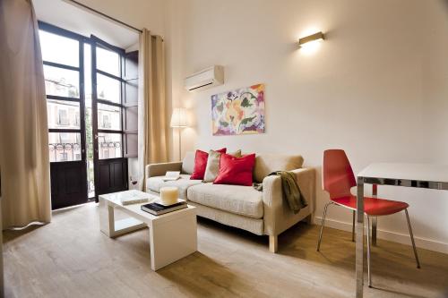 a living room with a couch and a table at Casa Miravalle Darro in Granada