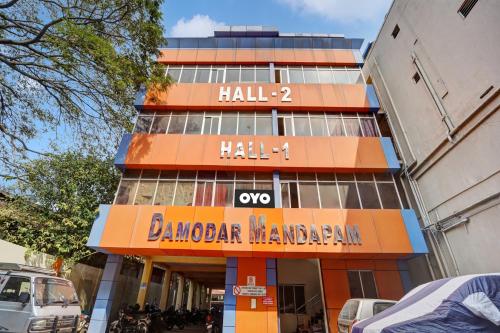 a building with a sign that reads hell hall gmaxwell zombie manaran at Hotel O Trident Inn in Coimbatore