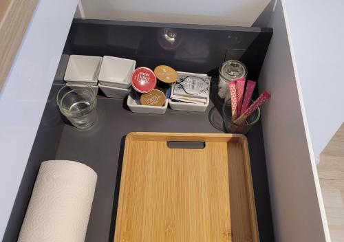 a drawer with a wooden door in a room at Les 3 Bulles in Gueux