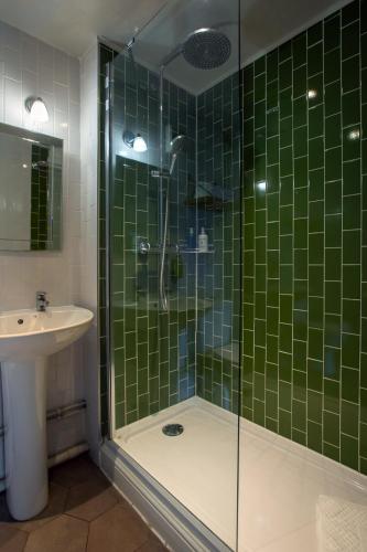 a bathroom with a shower and a sink at The Huntsman of Brockenhurst in Brockenhurst