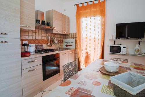 Kjøkken eller kjøkkenkrok på Sardinia's house IUN R5500