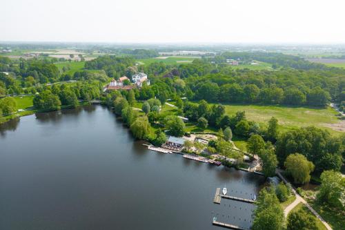 an aerial view of a lake with a dock at Glamping Borken in Borken